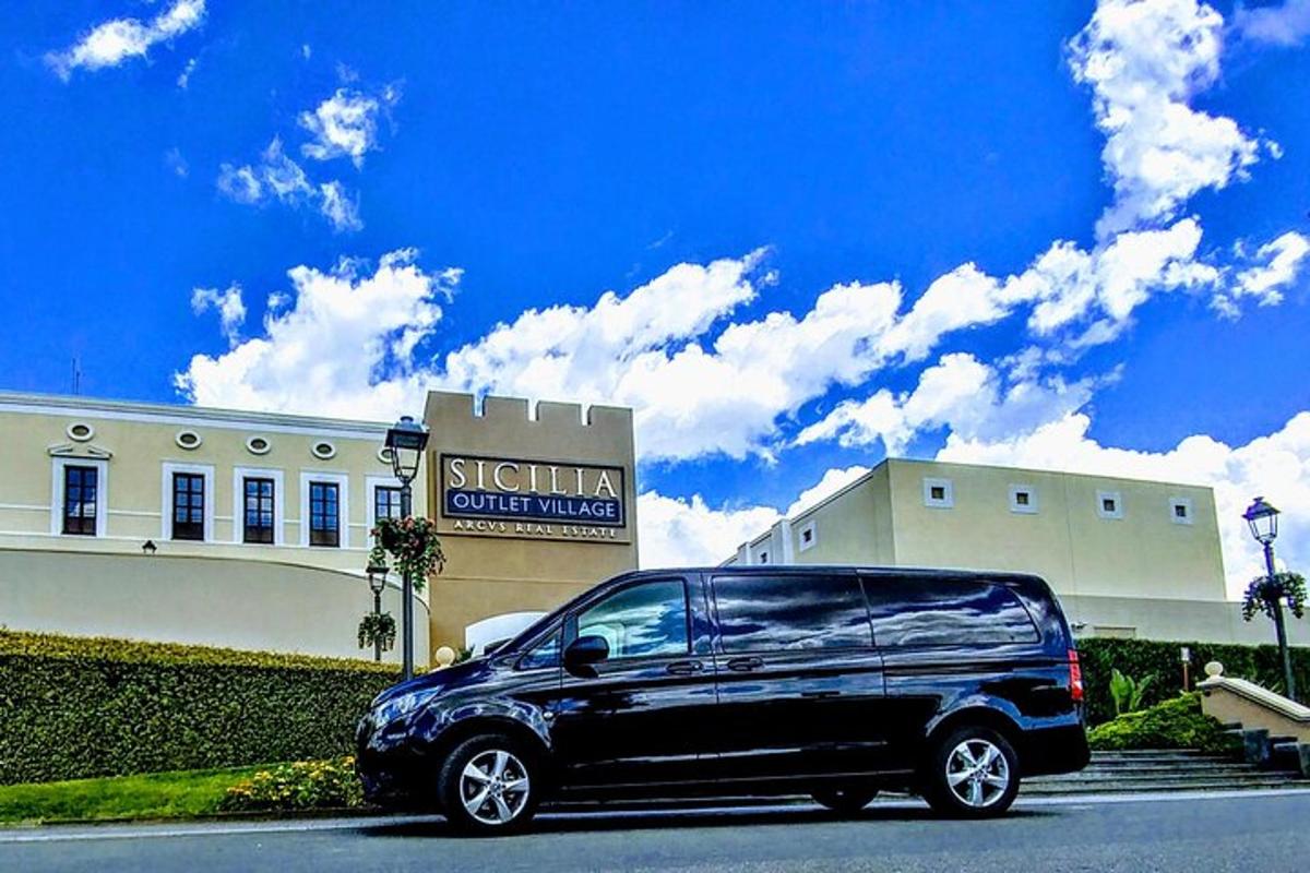 a black van parked in front of a building
