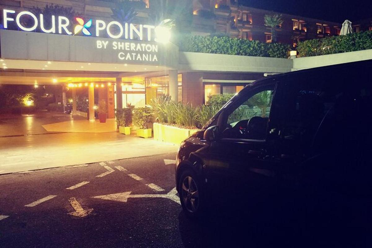 a car parked in a parking lot in front of a store