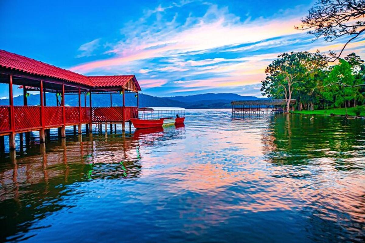 a red dock on a body of water