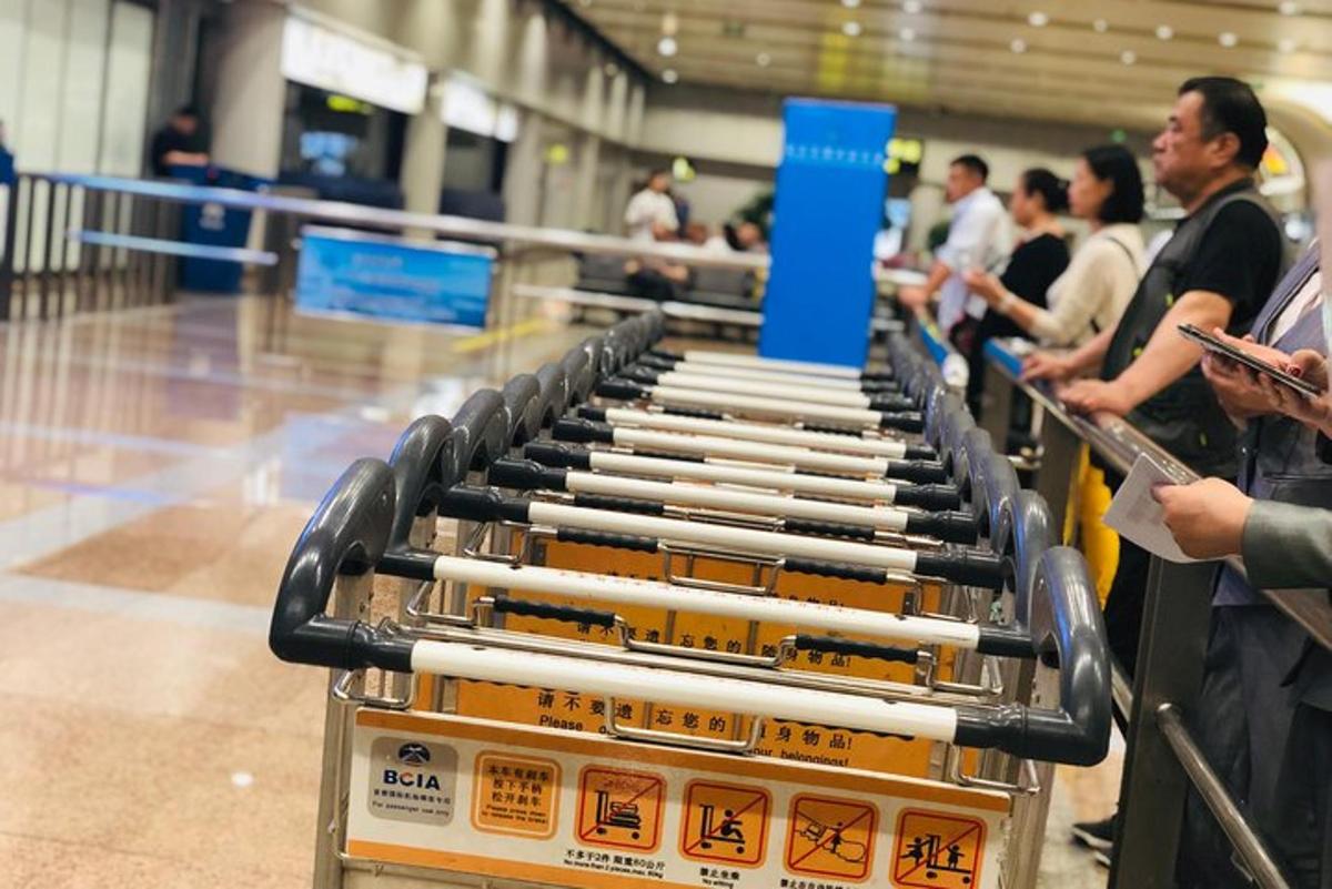 a shopping cart filled with lots of chopsticks in an airport