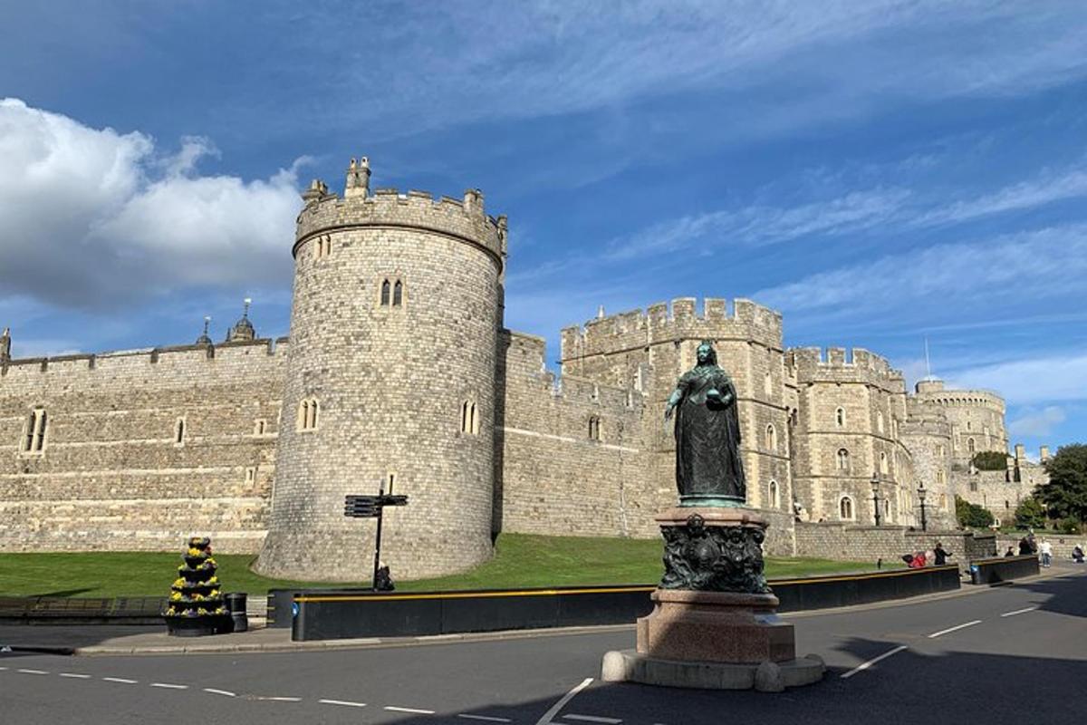 a castle with a statue in front of it