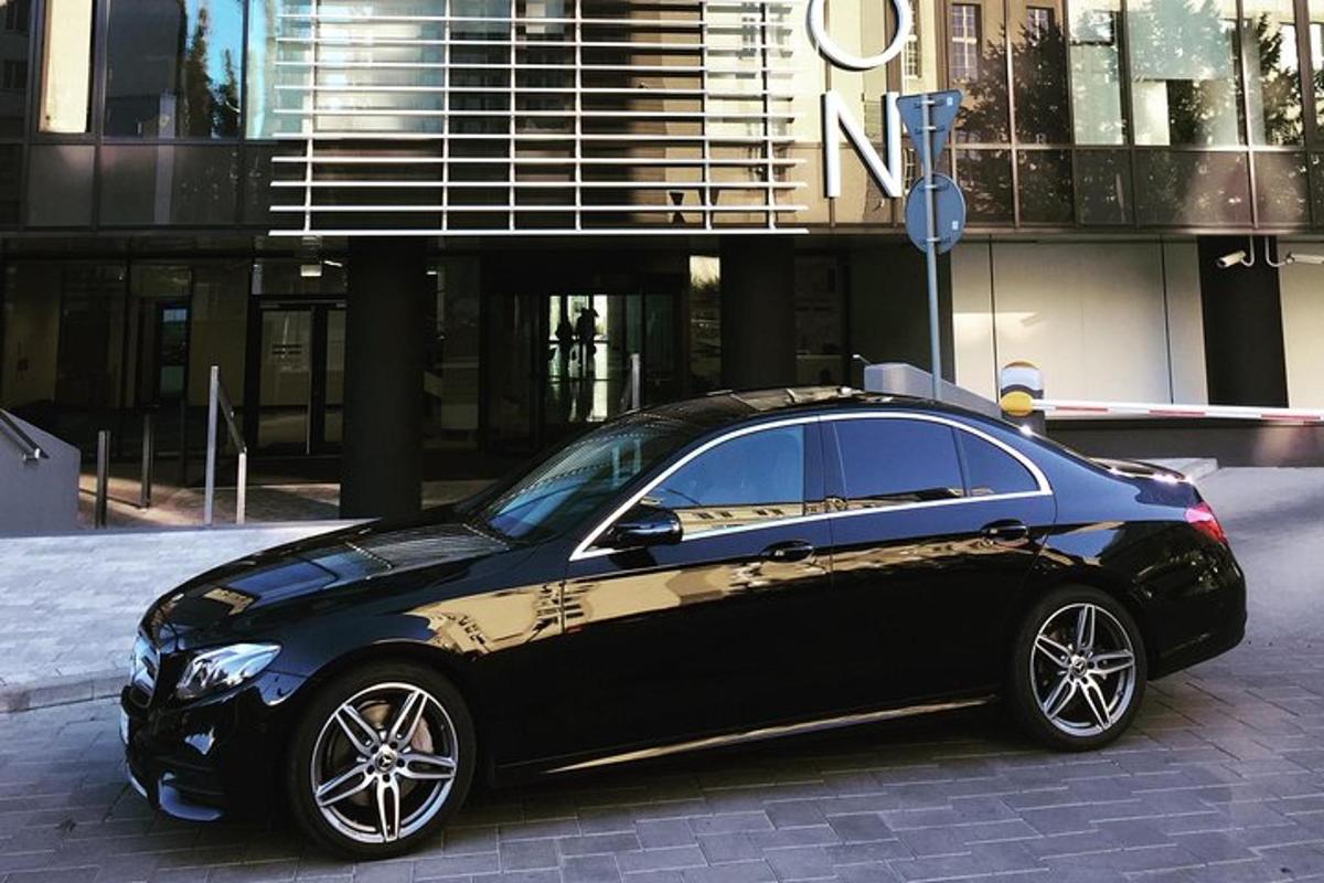 a black car parked in front of a building