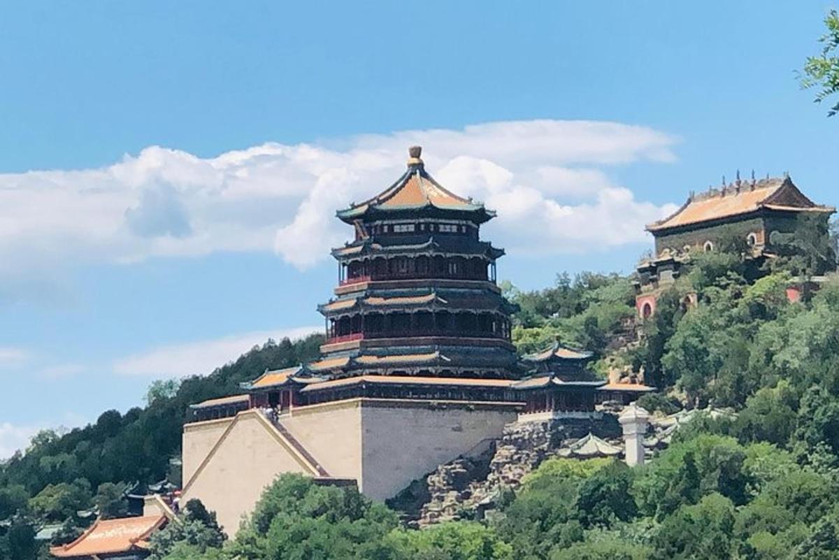 a building on top of a hill with trees