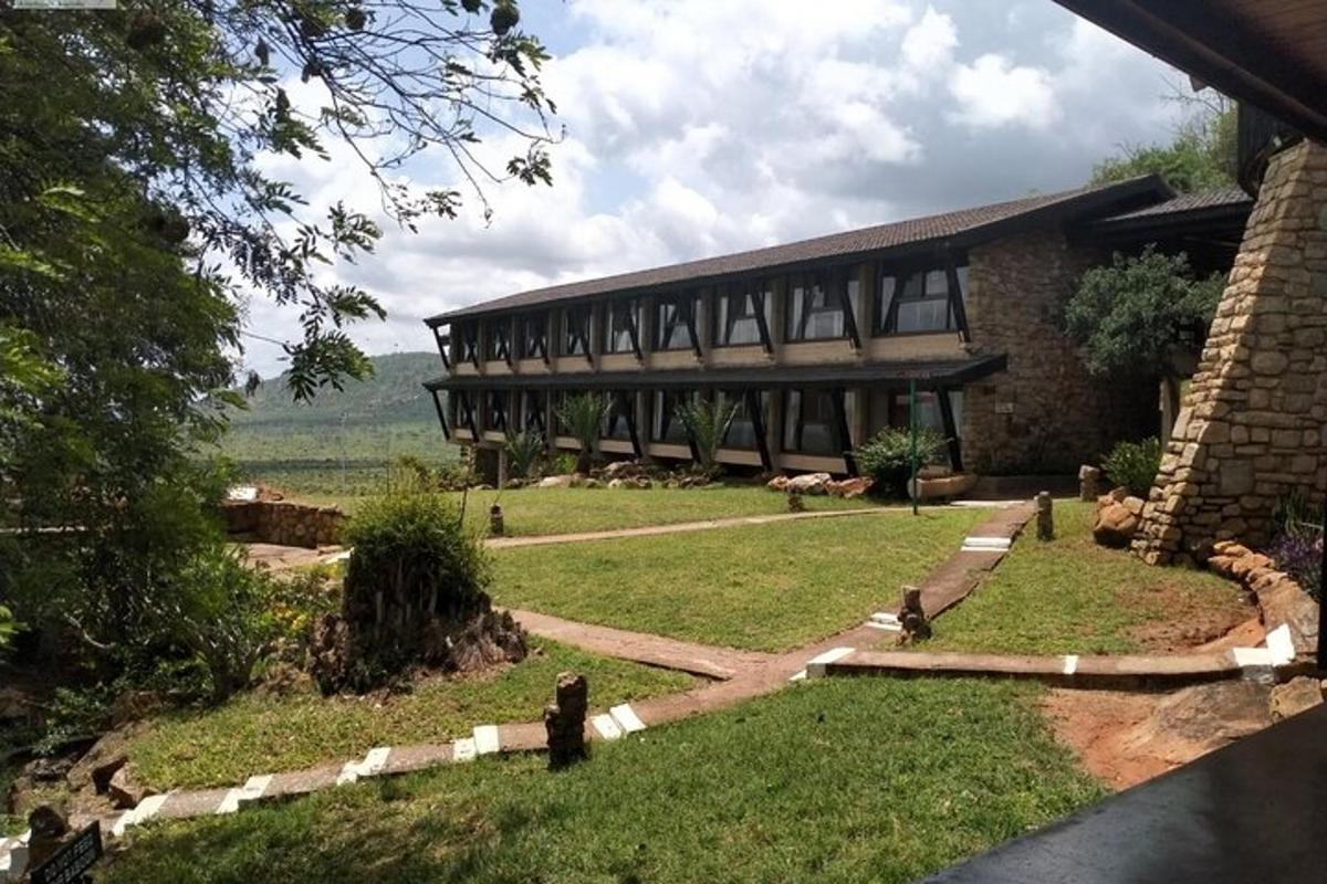 a large building with a grass yard in front of it