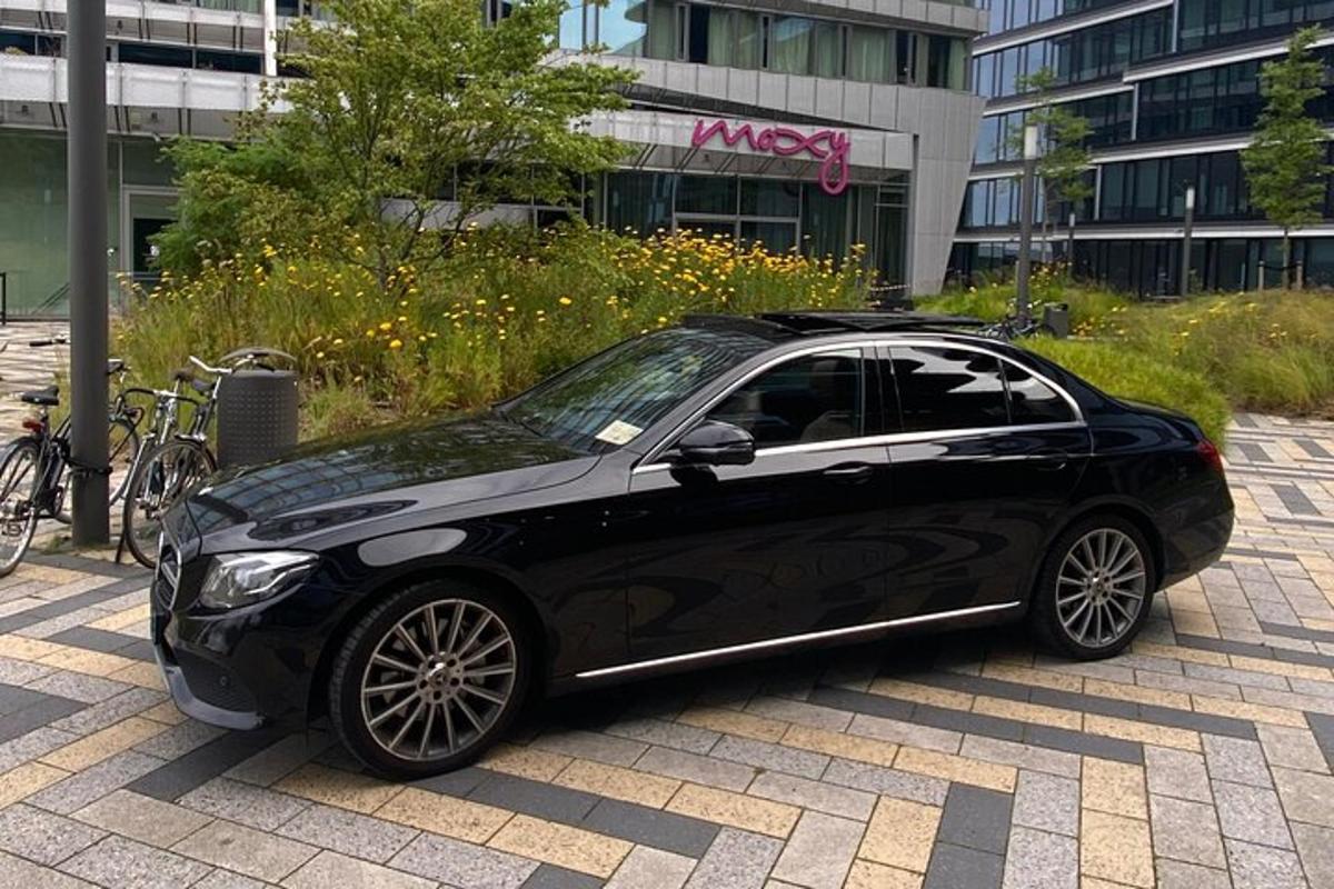 a black car parked in front of a building