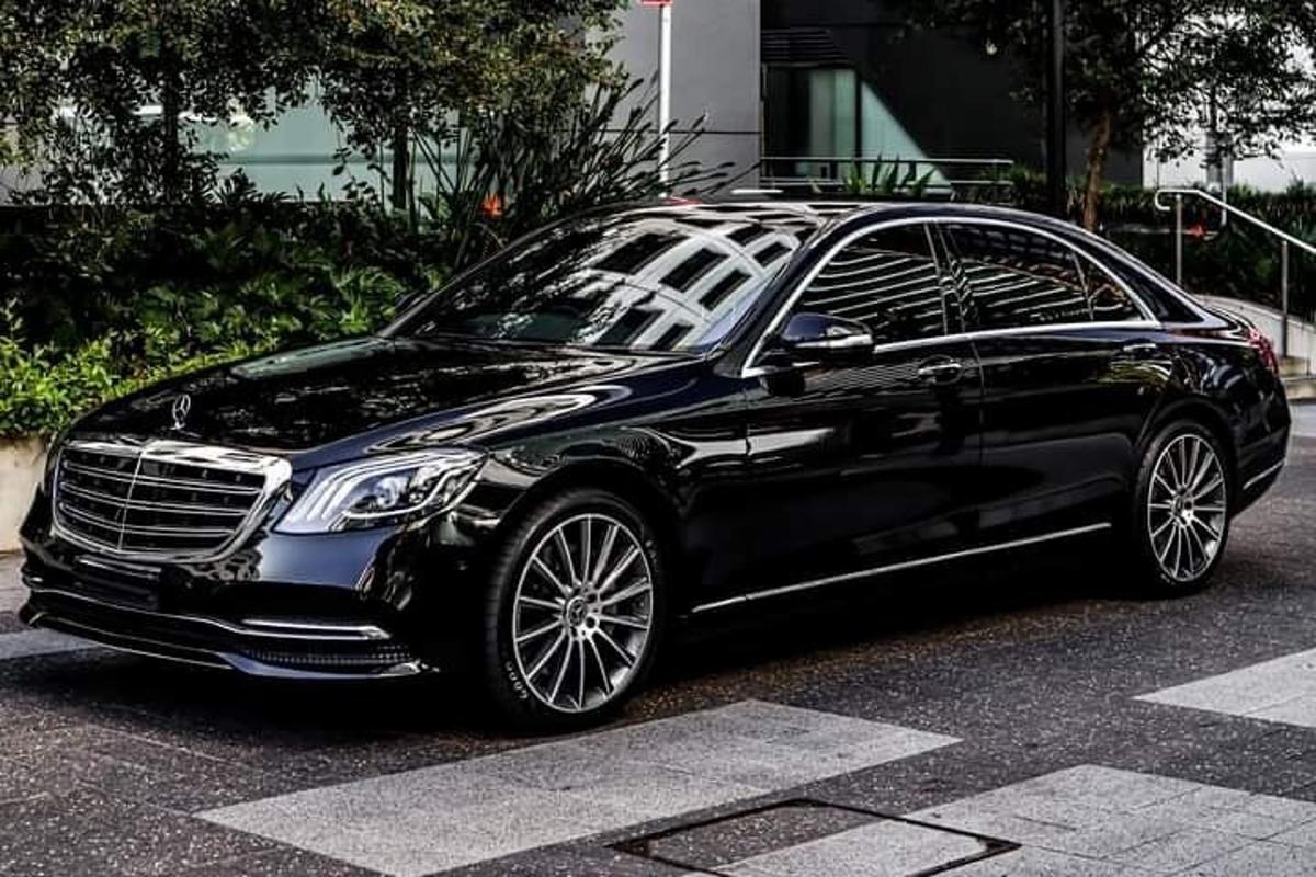 a black car parked in a parking lot