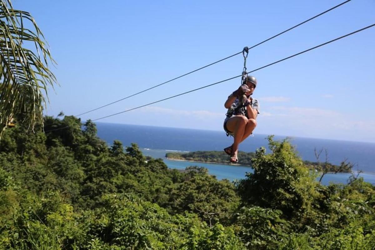 a woman is sitting on a zip line