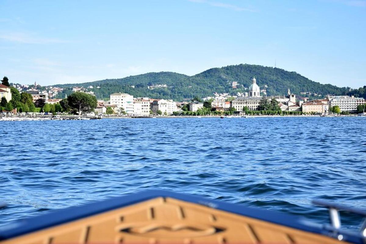 a boat on the water with a city in the background