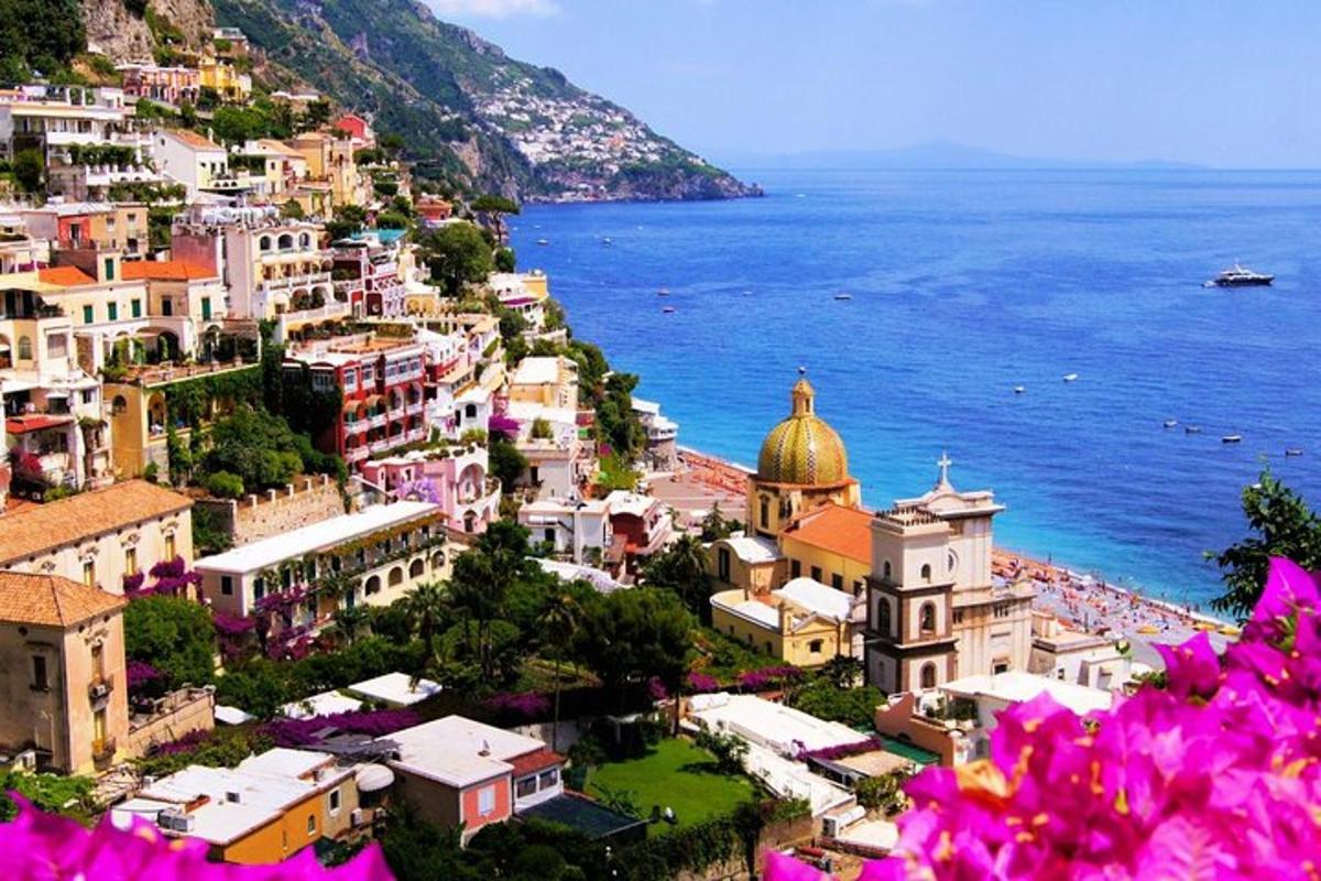 a view of the amalfi coast with pink flowers