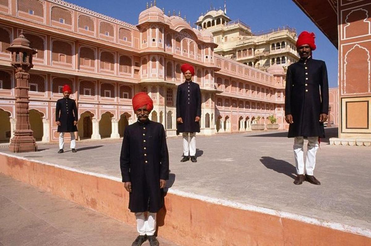 a group of men in uniform standing in front of a building
