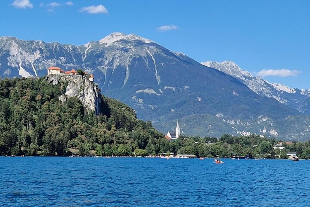 a large body of water with a mountain in the background
