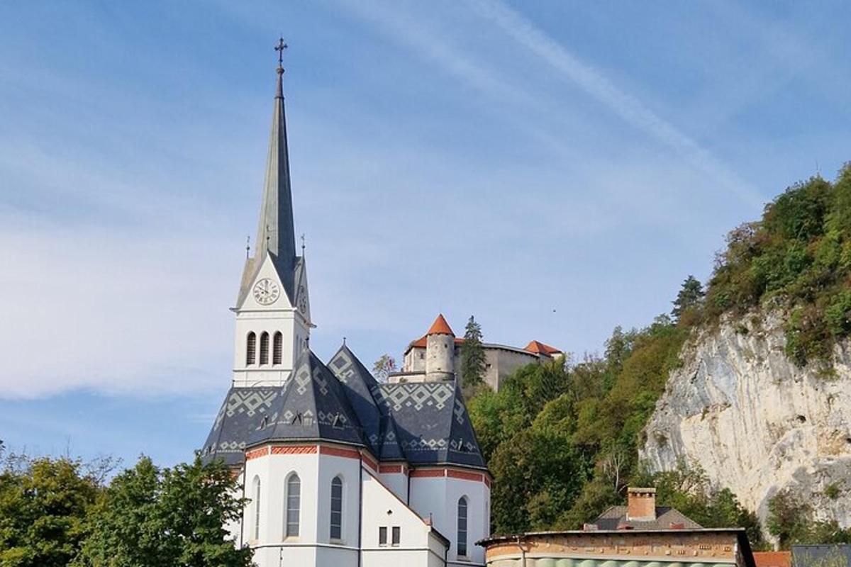 a castle with a steeple on top of a mountain