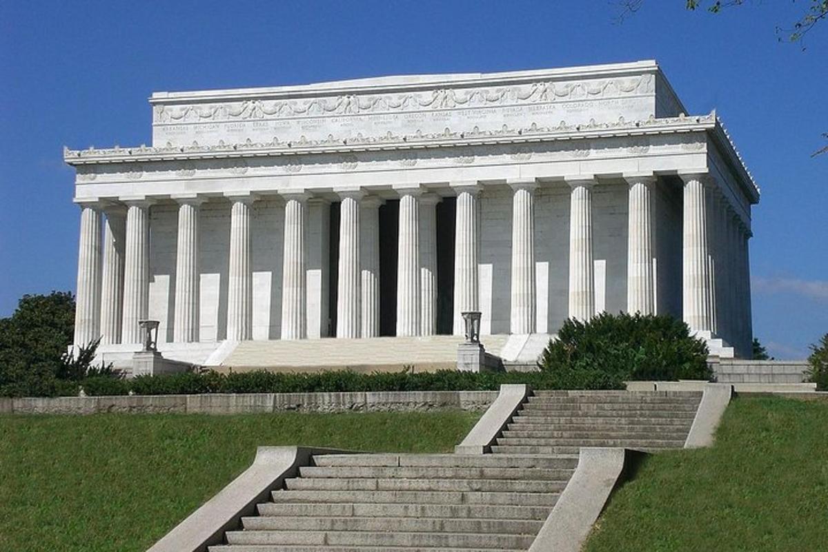 a large white building with steps in front of it