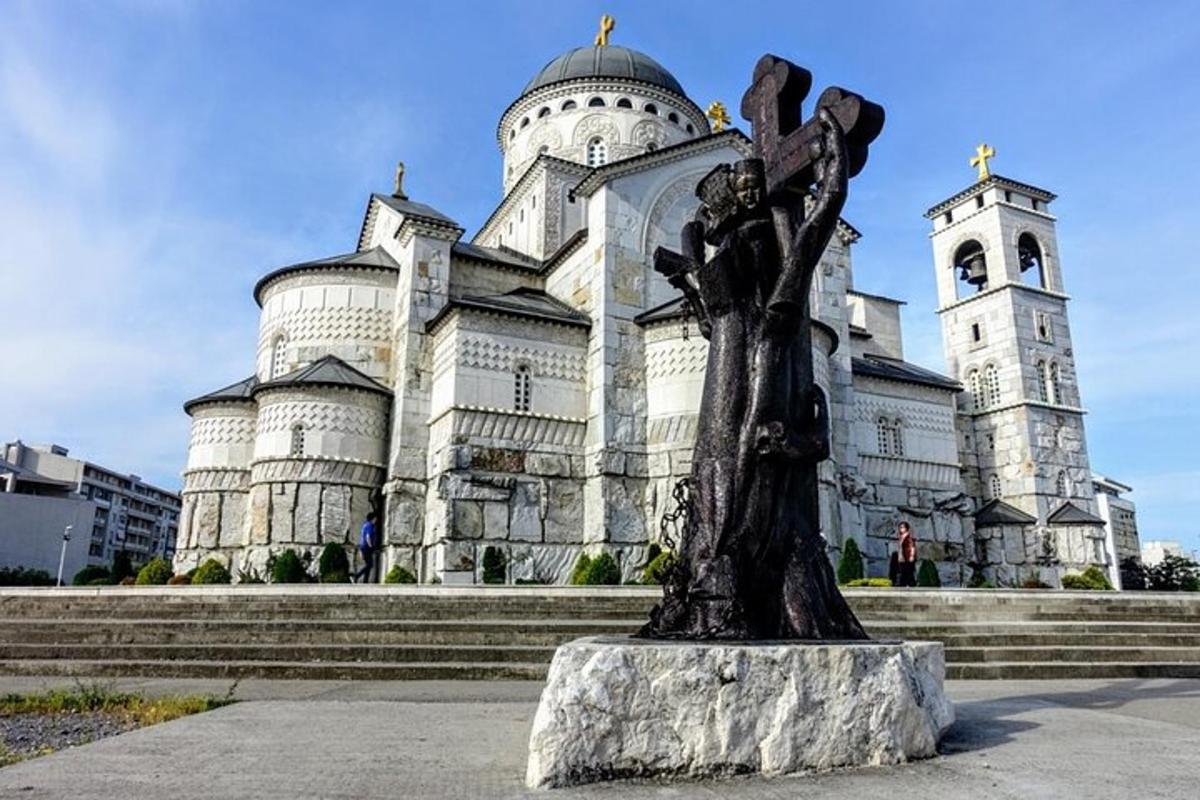 a large building with a statue in front of it