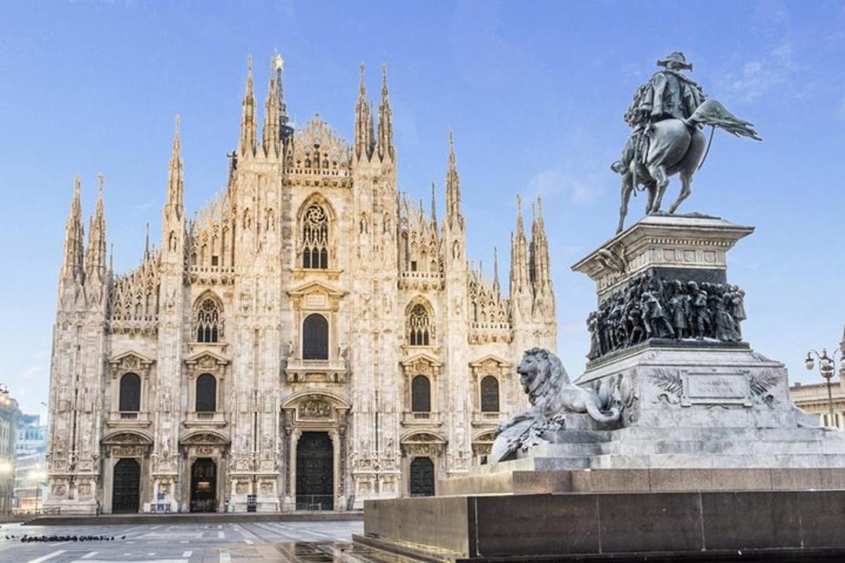 a statue of a man on a horse in front of a building
