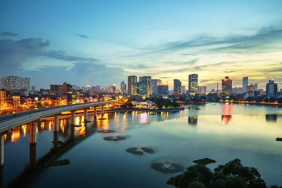 a city skyline with a bridge over a river