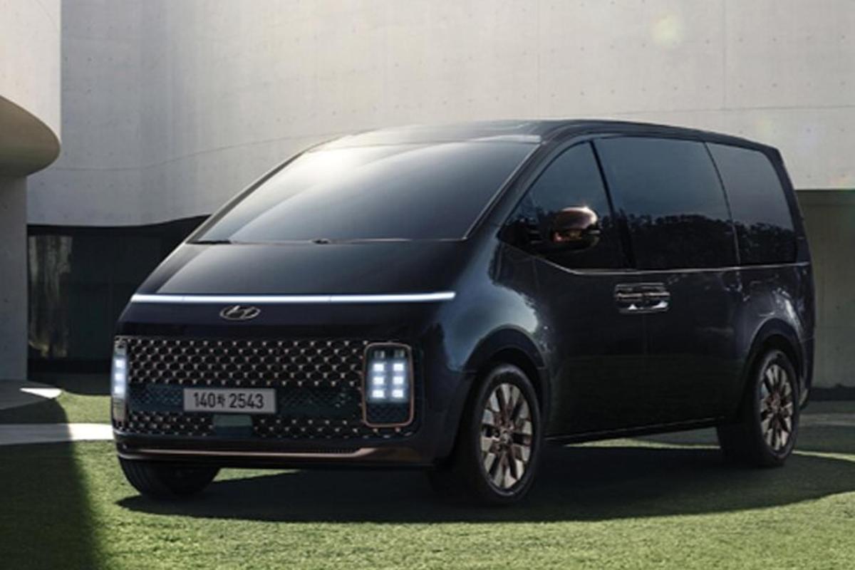 a black van is parked in a field