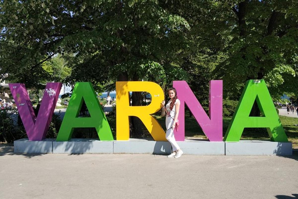 a woman standing in front of a large sign