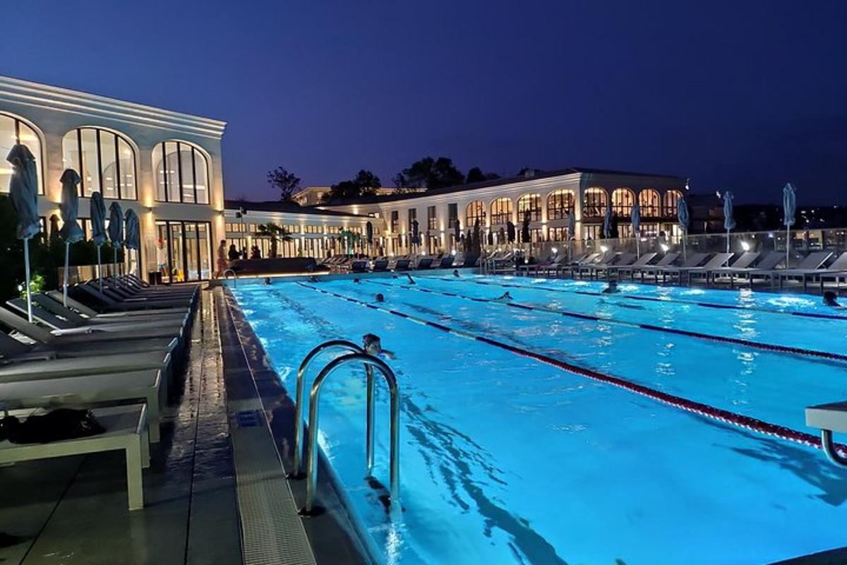 a large swimming pool at a hotel at night