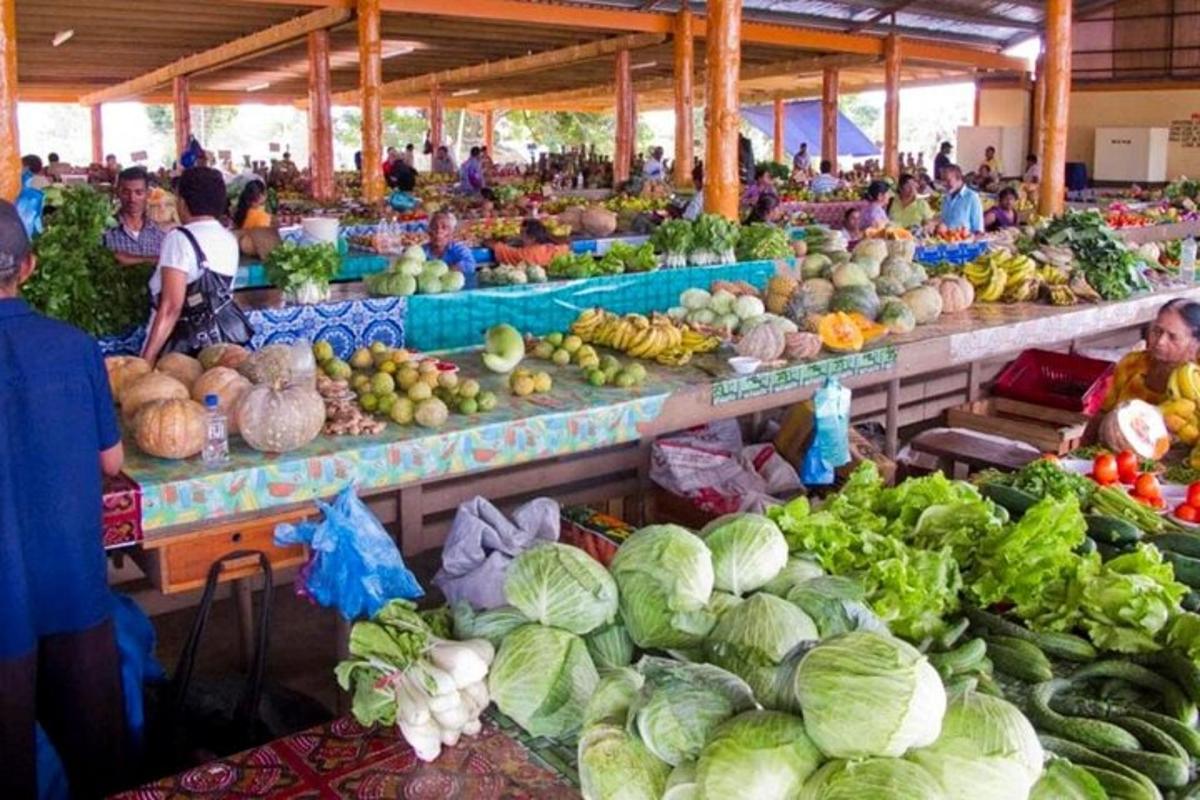 a market filled with lots of fruits and vegetables