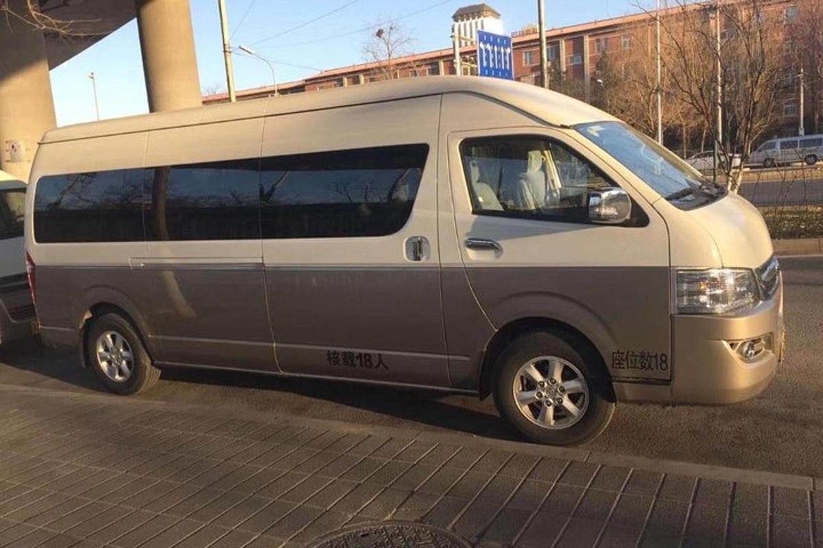 a silver van parked on the side of a street