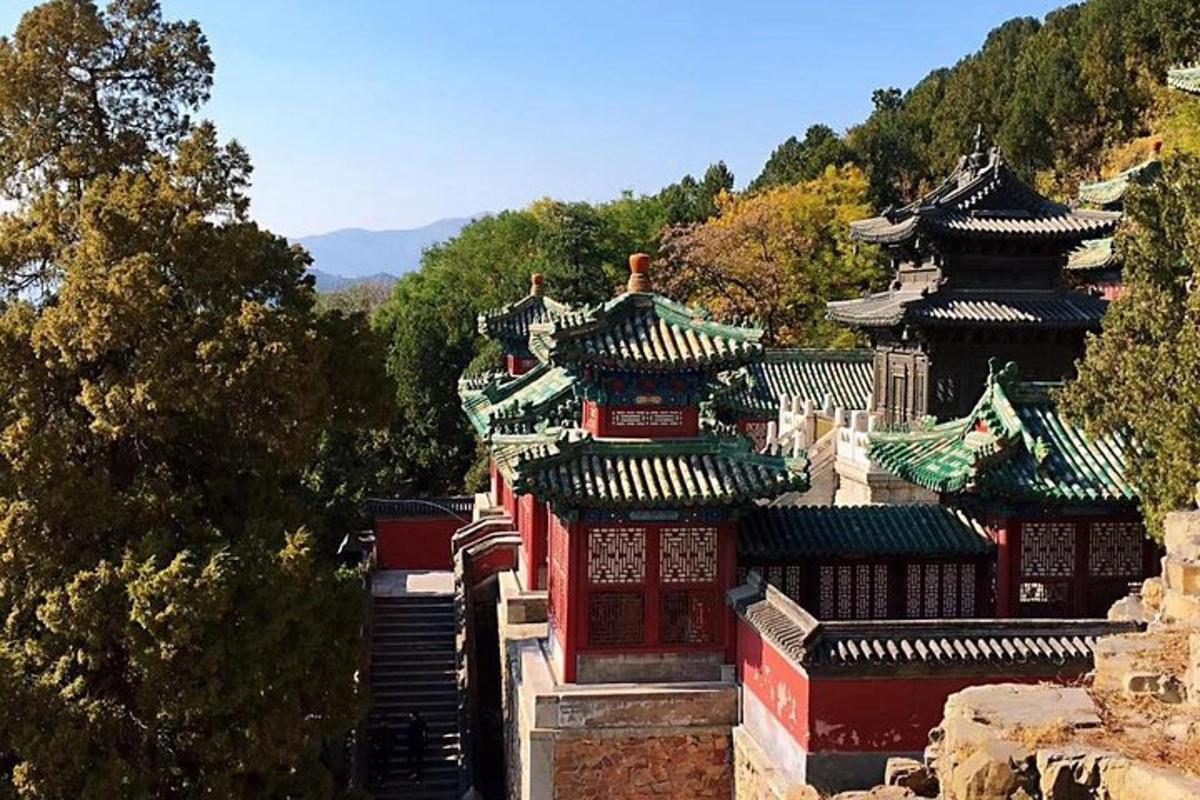 a group of buildings with roofs on a mountain