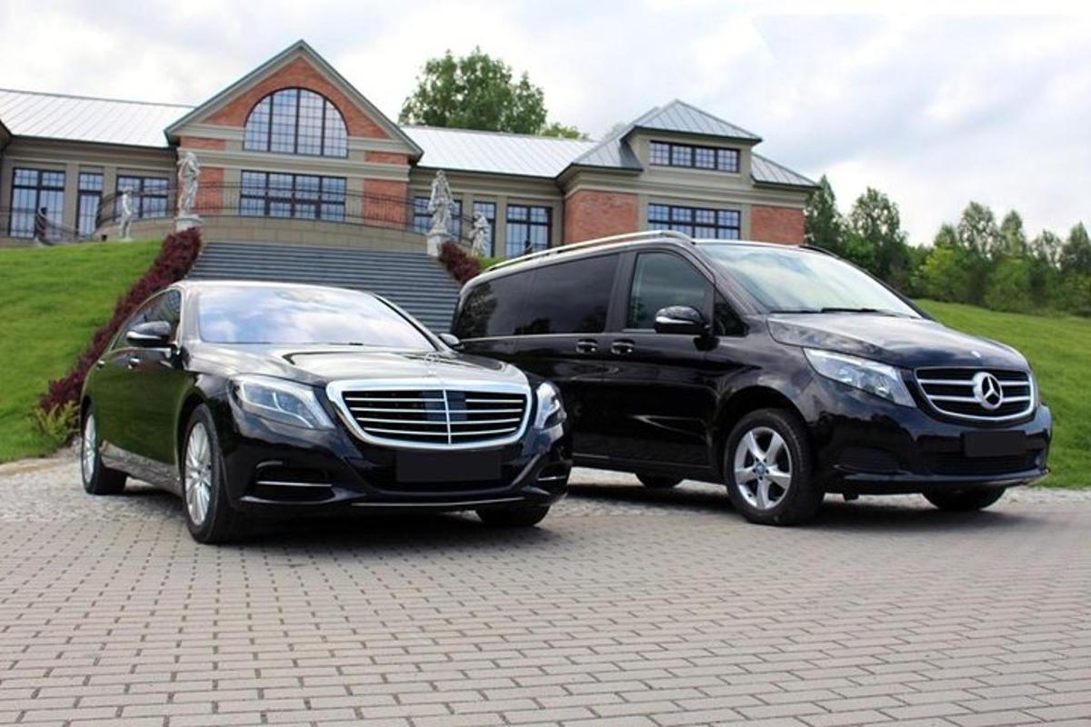 two vehicles parked in front of a house