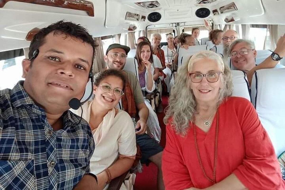 a group of people sitting on a bus