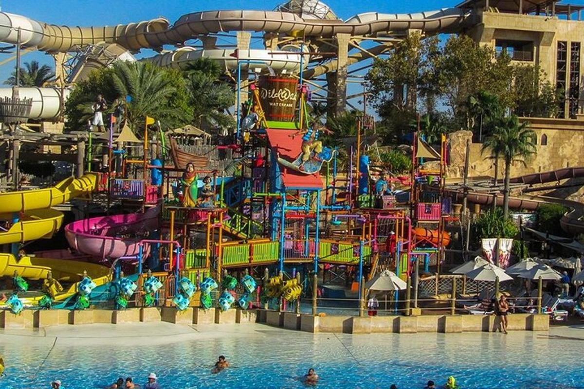a water park with a water slide in a pool