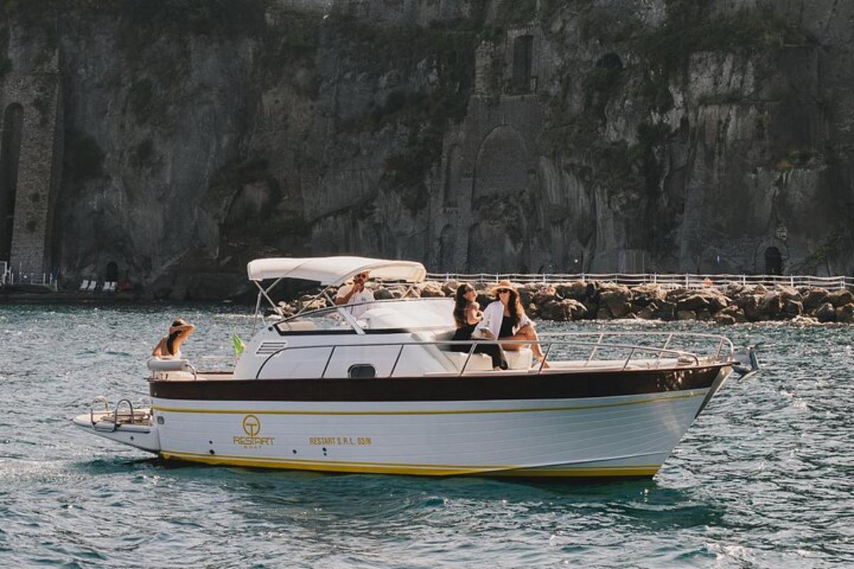 a group of people on a boat in the water