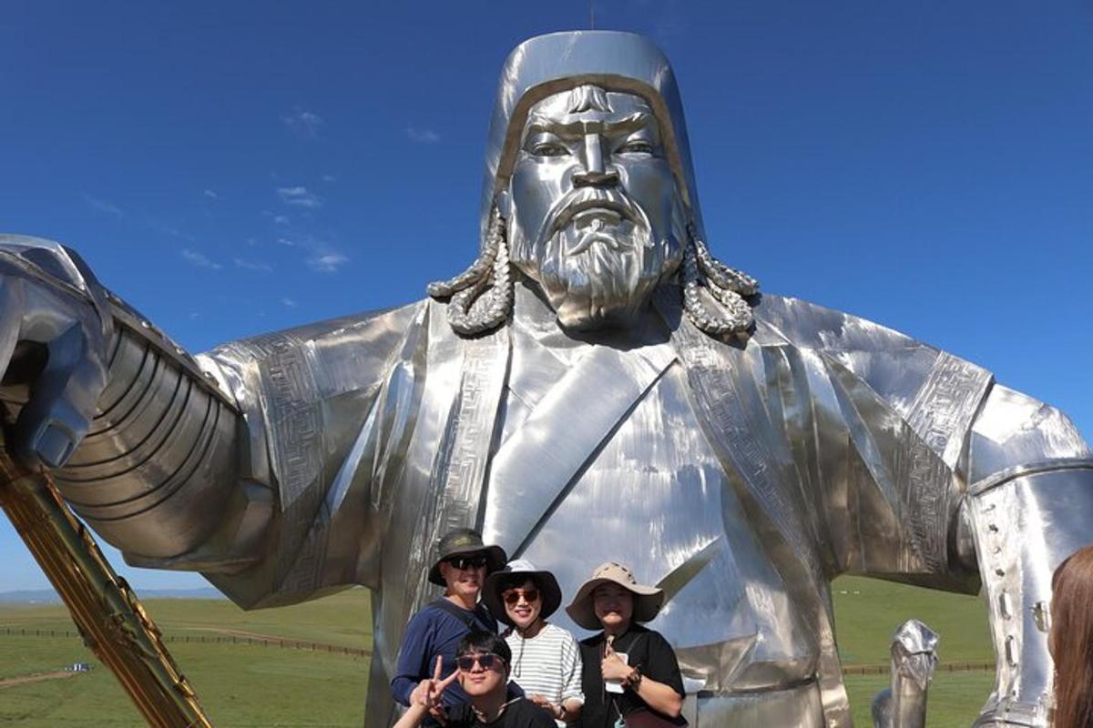 a group of people standing in front of a statue
