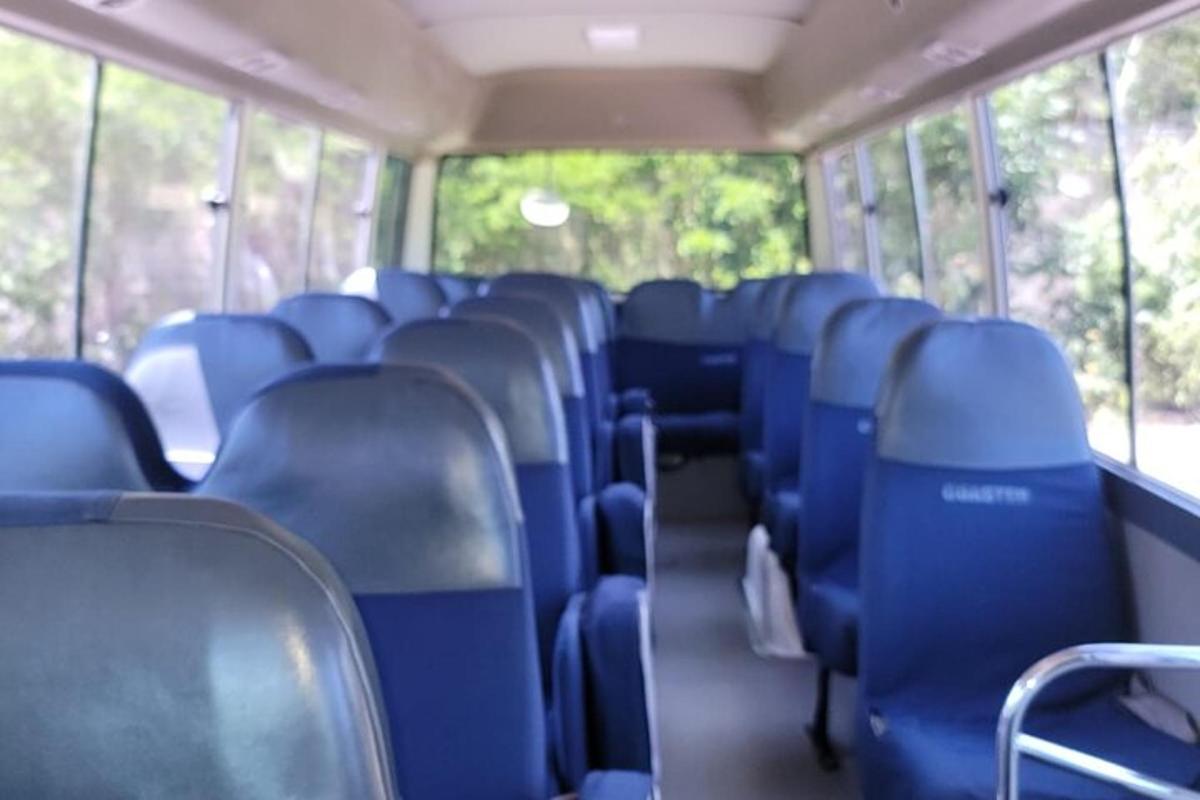 a bus with blue seats on a bus