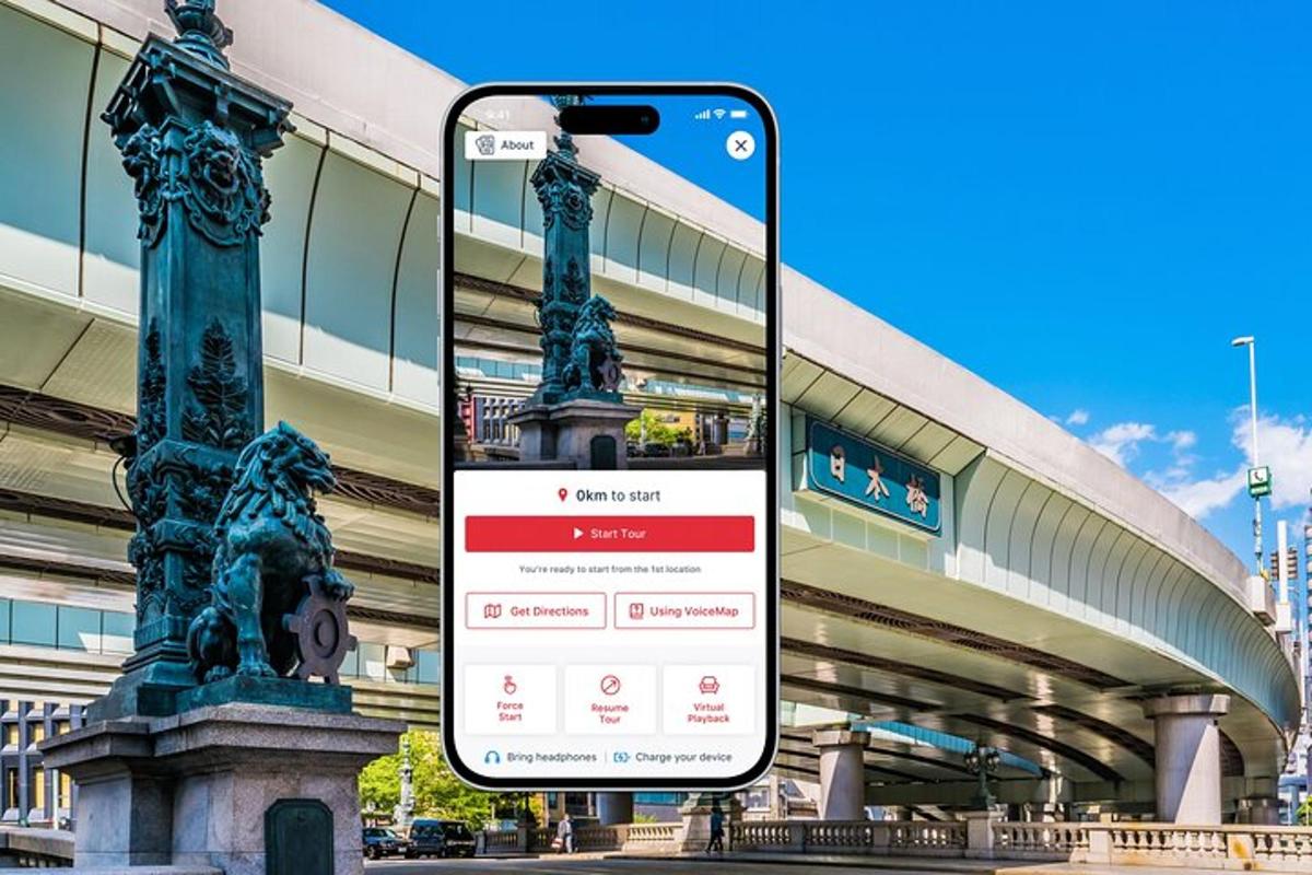 mobilusis telefonas priešais pastatą