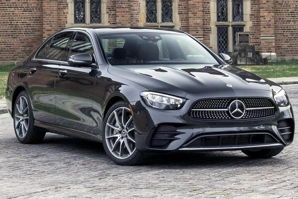 a black mercedes benz car parked on a street