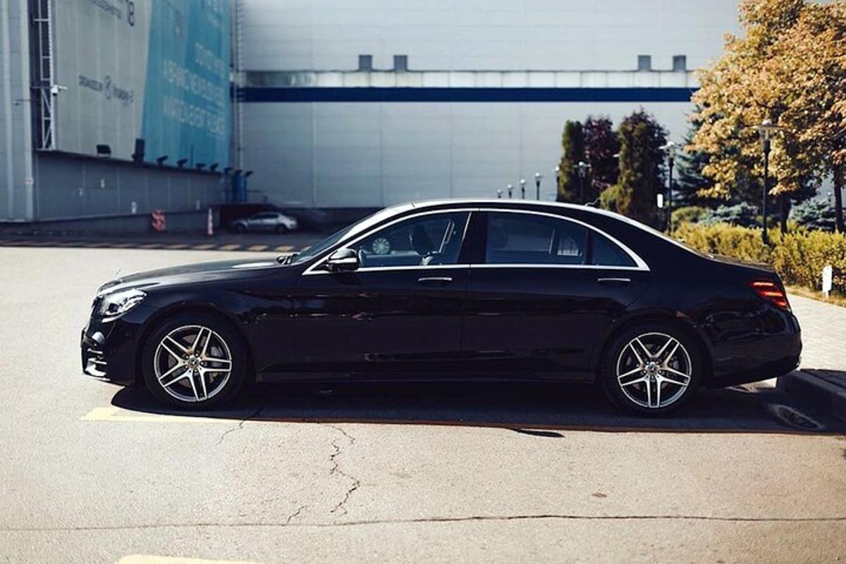 a black car parked in a parking lot