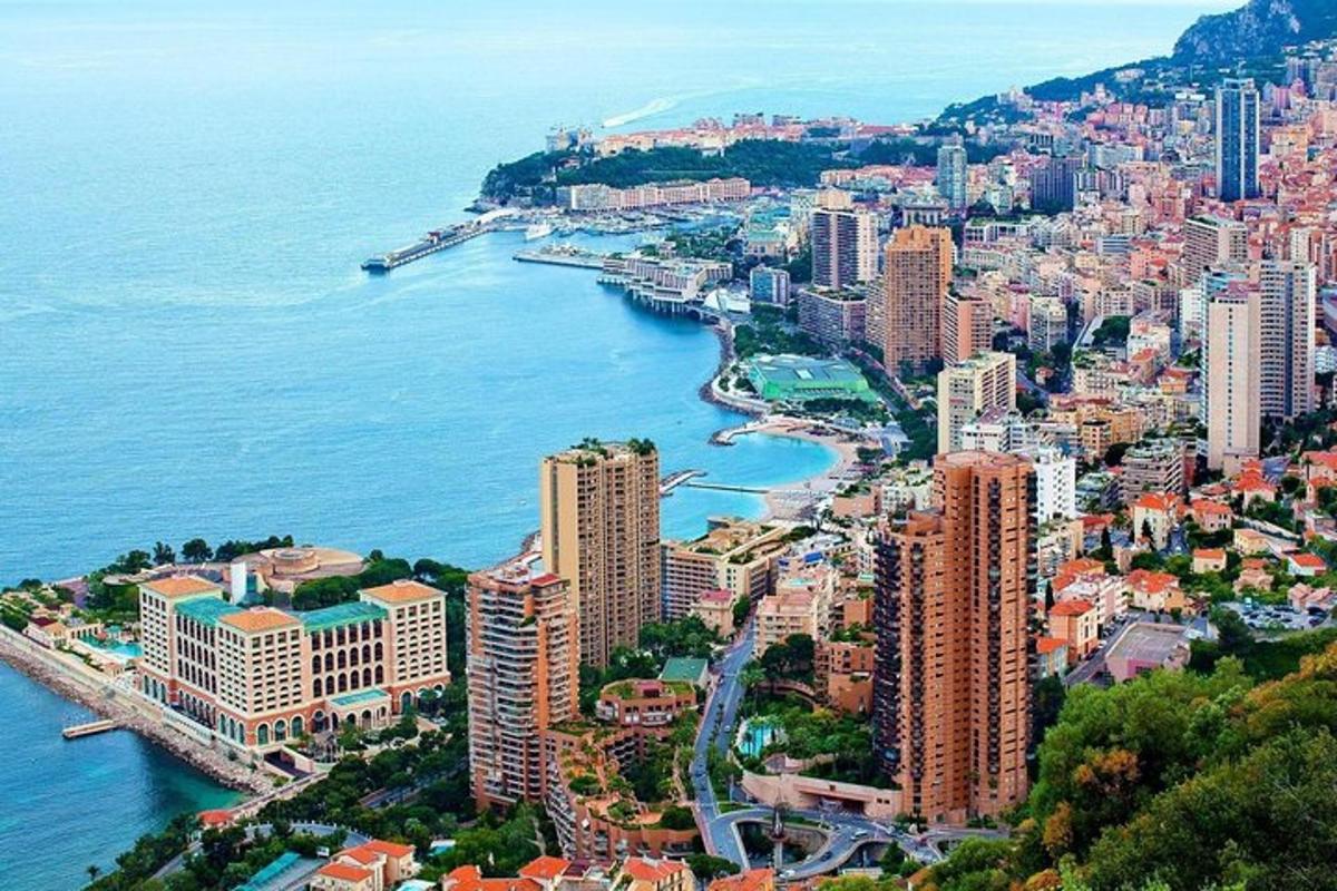 an aerial view of a city next to the water