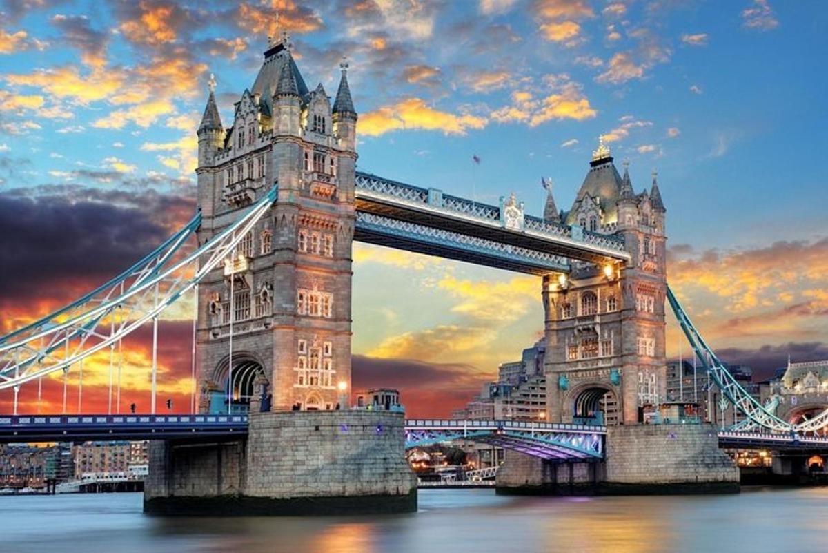 a suspension bridge in london at sunset