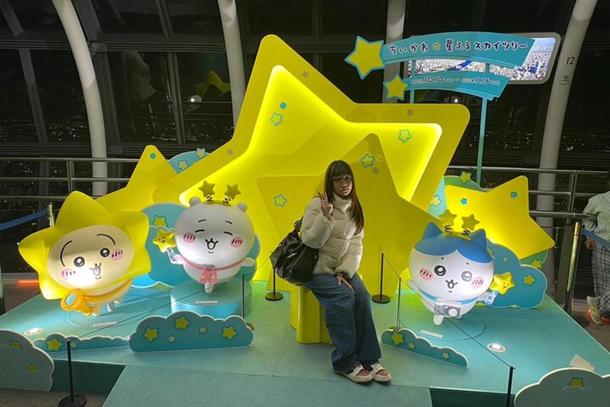a woman is sitting in front of a star