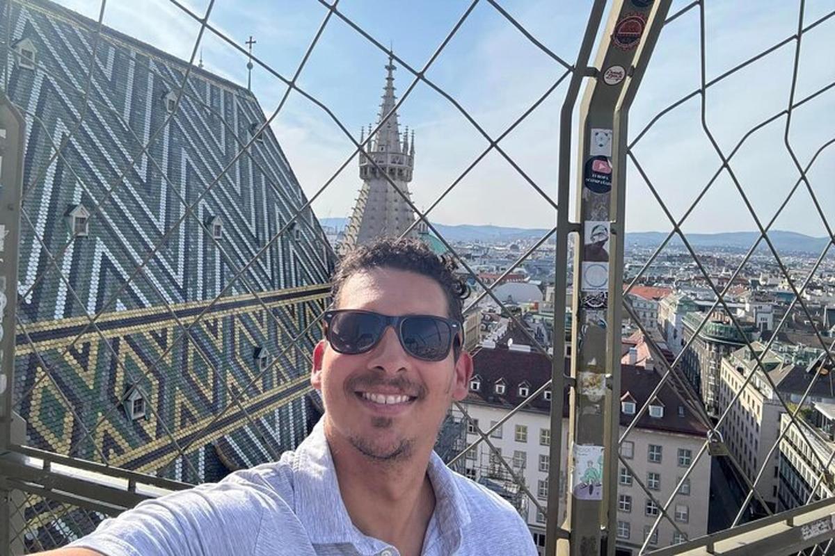 a man in a ferris wheel in front of a city