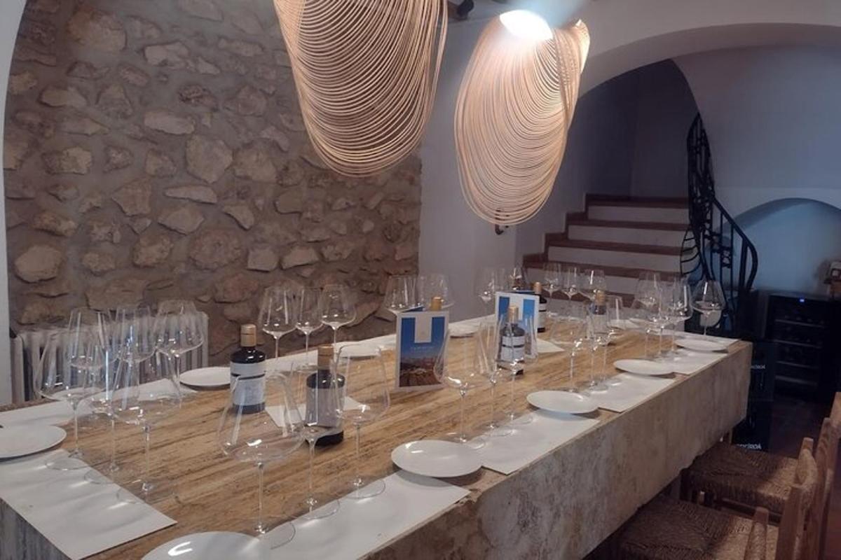 a long table with wine glasses on top of it