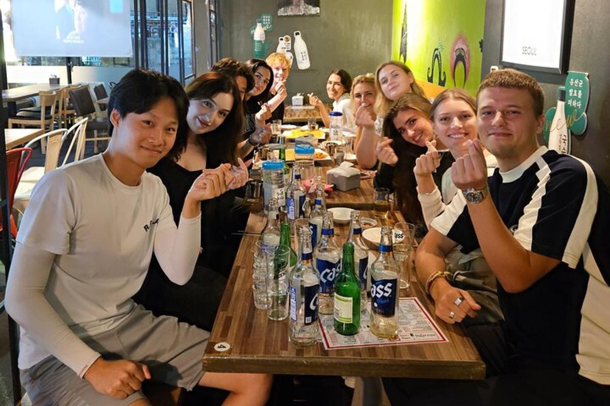 a group of people sitting around a table with drinks