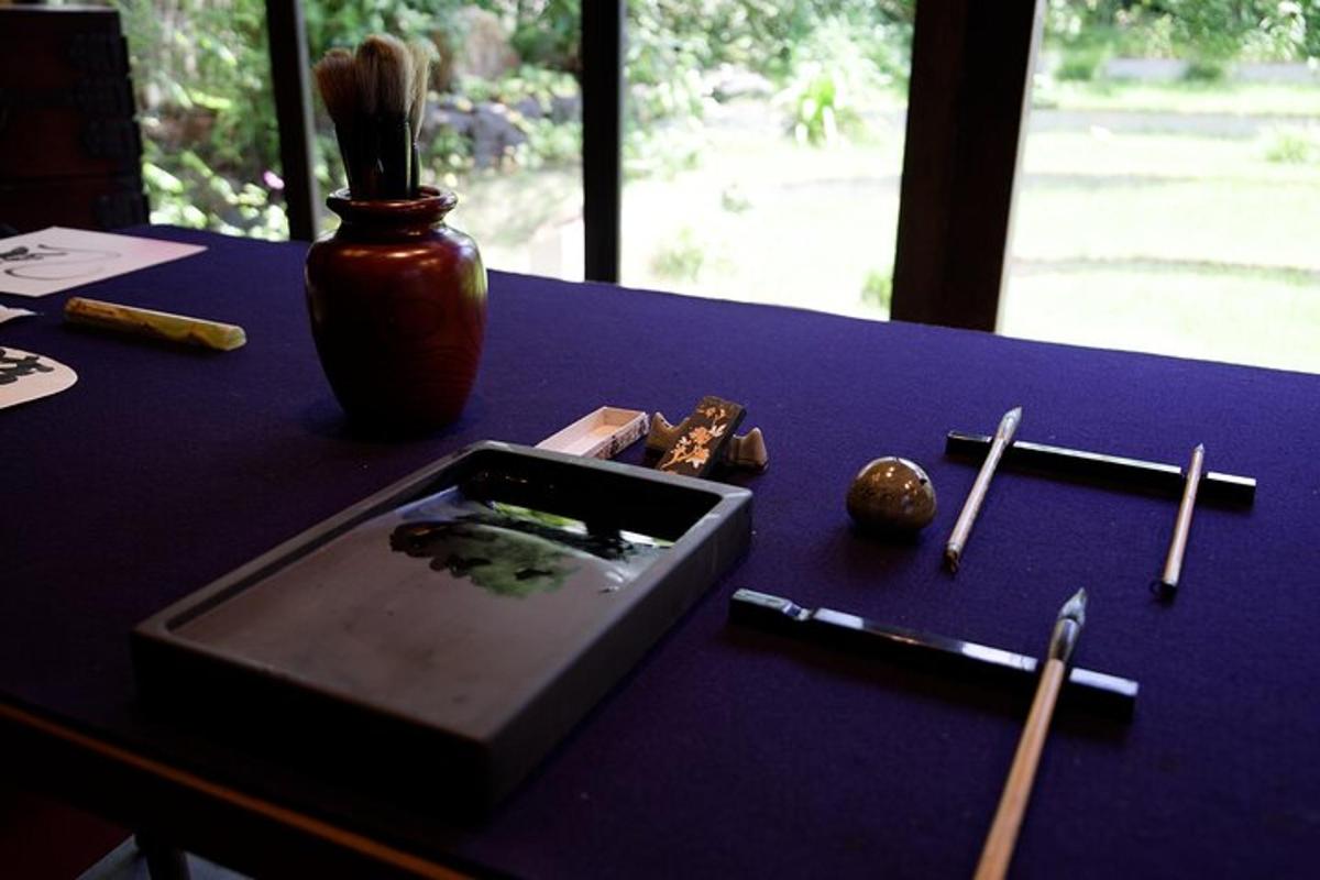 a purple table with chop sticks and a box on it