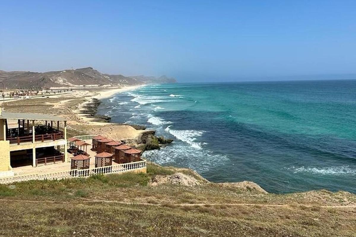 a view of a beach with houses and the ocean