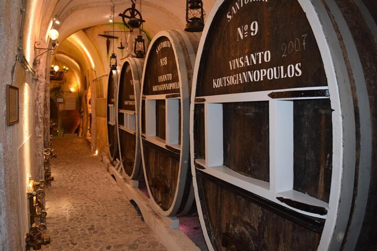 a row of wine barrels in a cellar