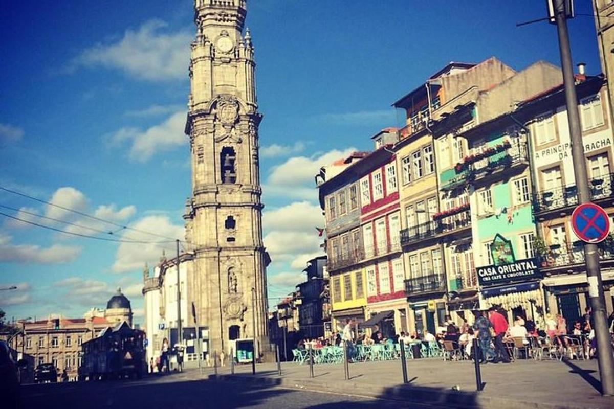 a tall tower with a clock on it in a city