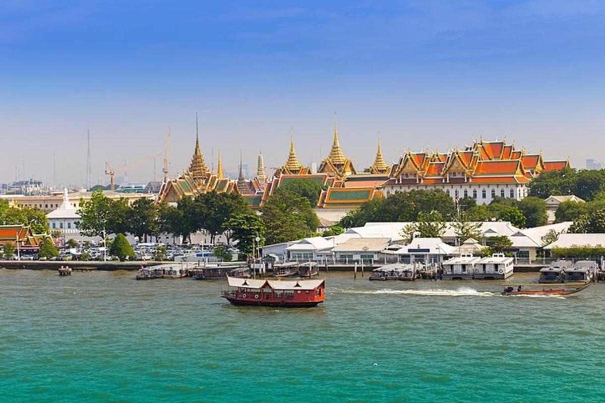 a boat in the water in front of a city