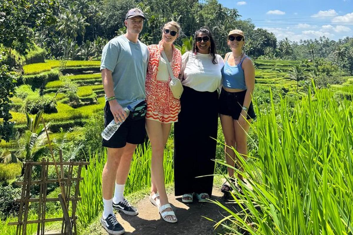 a group of people standing in front of a field