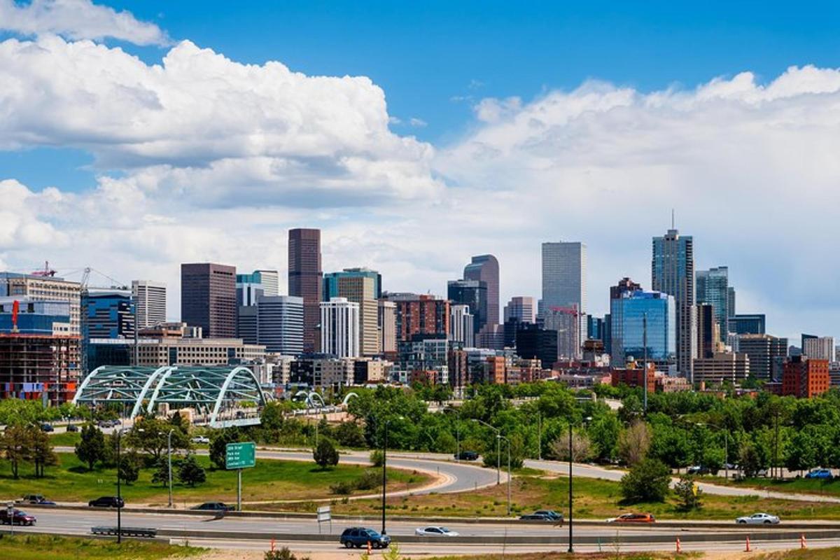 a city skyline with a highway in front of it