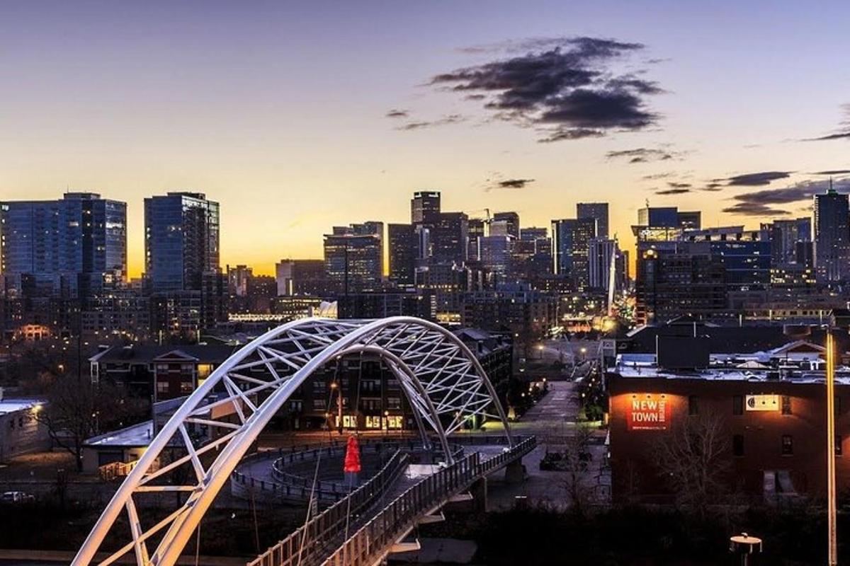 a view of a city with a bridge at night