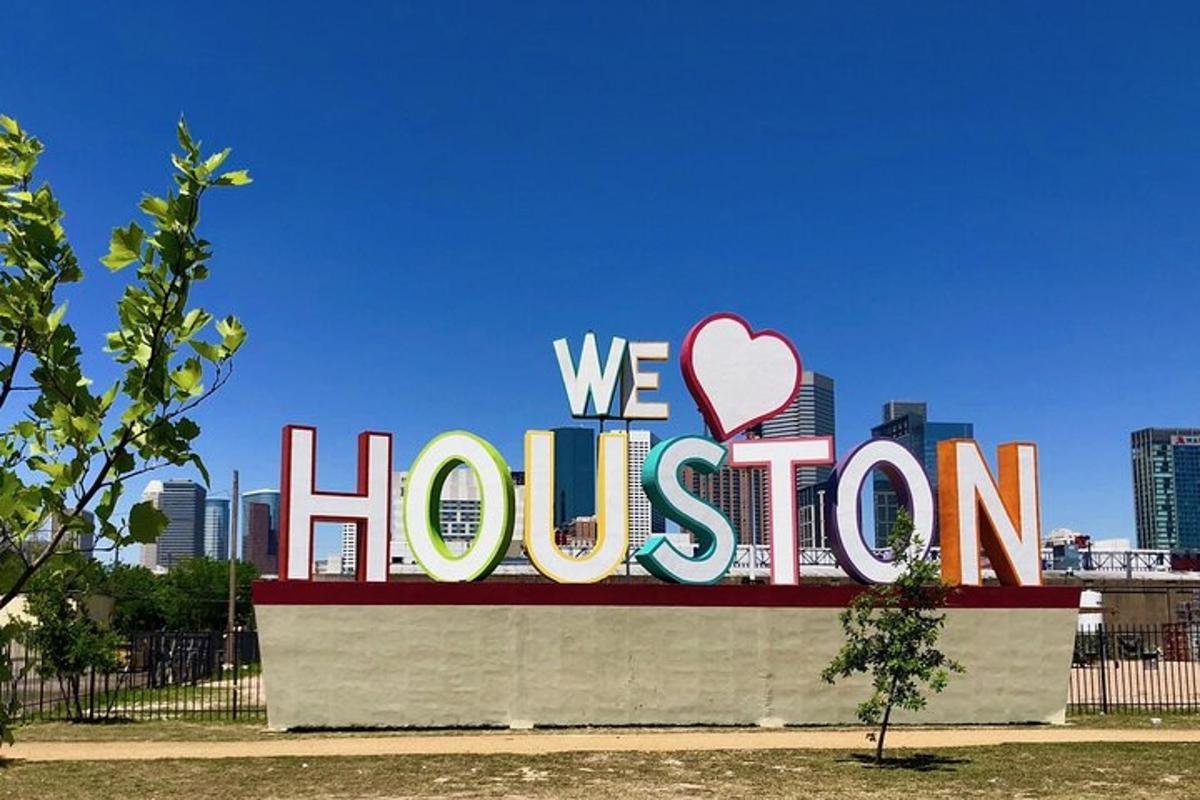 cedule s nápisem „Milujeme Houston ve městě“